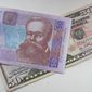 Курс гривны упал к доллару США еще на 0.91%